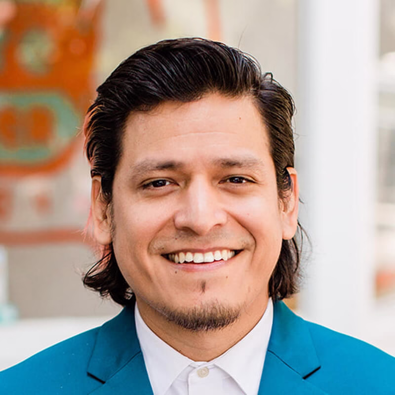 Ismael Beltran, Hispanic man with a streak of pink hair